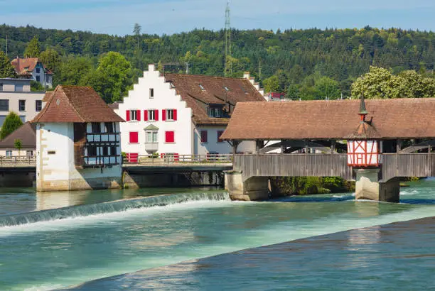 Medieval bridge over the Reuss river in the town of Bremgarten in summertime. Bremgarten is a municipality in the Swiss canton of Aargau, its medieval old town is listed as a heritage site of national significance.