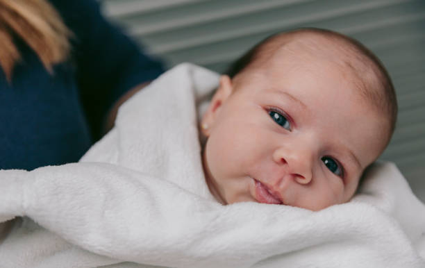 Baby girl looking at camera stock photo