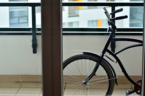 City bicycle parked in modern apartment