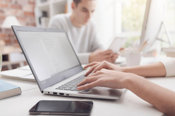 istock Woman using a laptop and connecting 1127712894