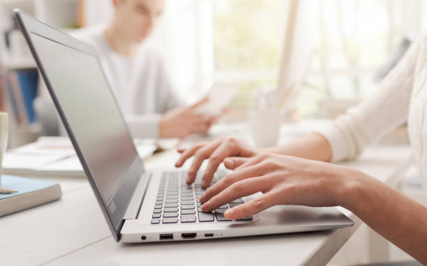 istock Woman using a laptop and connecting 1127713626