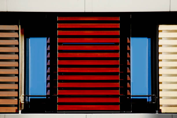 istock Jalousie / blinds / louvers over windows. Abstract modern architecture, interior or technology background photo. Lath / grid structures in several different colors. 1127713732