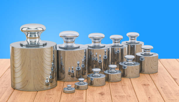 istock Weights Scale Calibration Set on the wooden table, 3D rendering 1127713805