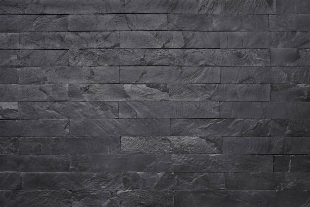 istock Black slate stone texture background, pattern of wall rocks in natural pattern with high resolution for design art work. 1127714200