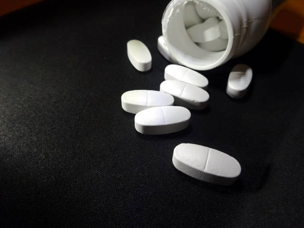 istock White pills in blister pack close-up 1127714446