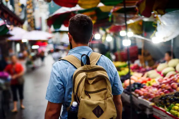 Photo of Traveler exploring Asian fruit market street