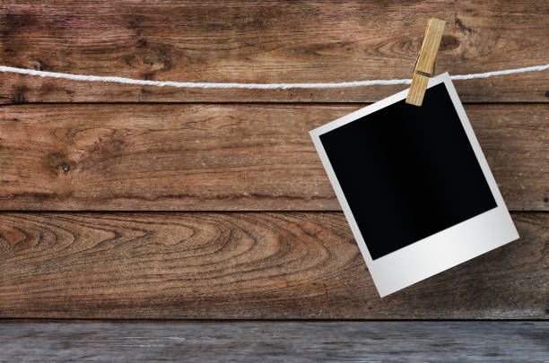 istock Clothespin hanging with blank photo papers. 1127723894