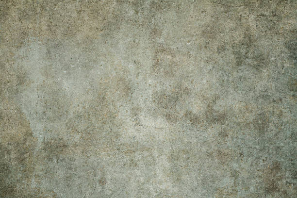 istock Concrete old dirty texture.Cement wall surface with old damage that is dirty and dusty. 1127724398