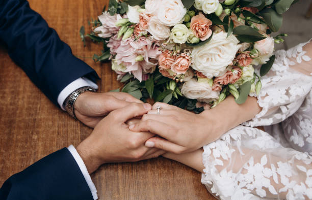 istock bride groom close together holding hands hugging 1127724500
