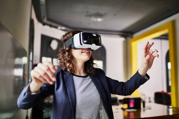 istock Business woman using virtual reality glasses 1127726448