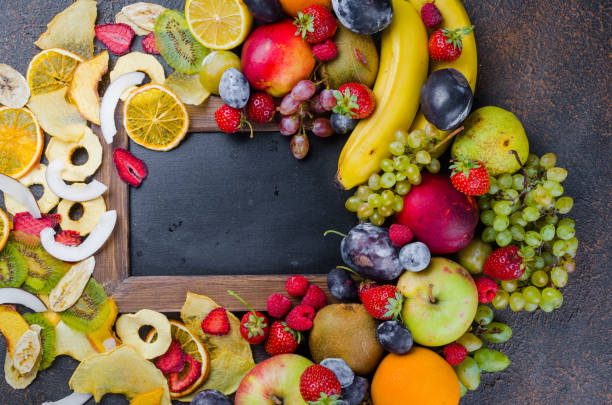 istock dried and raw fruits on dark background 1127726575