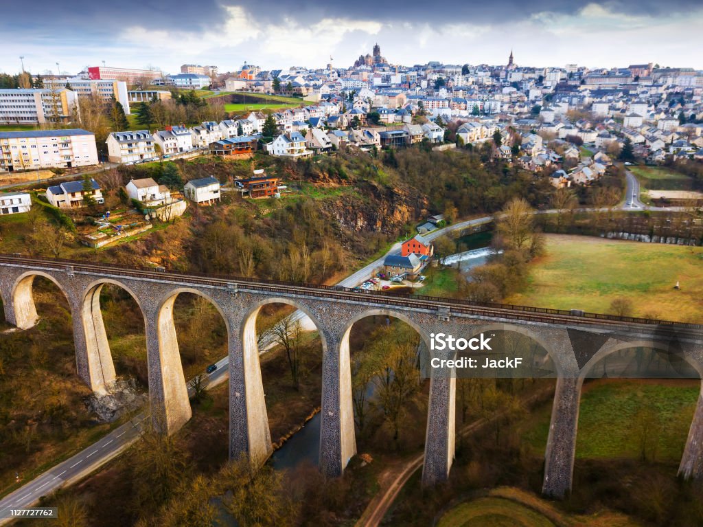 General view of Rodez with Gascarie Viaduct General view of Rodez city with Gascarie Viaduct on foreground in cloudy winter day, France Rodez Stock Photo