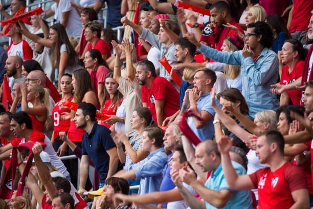 istock Group of spectators cheering in stadium 1127730063