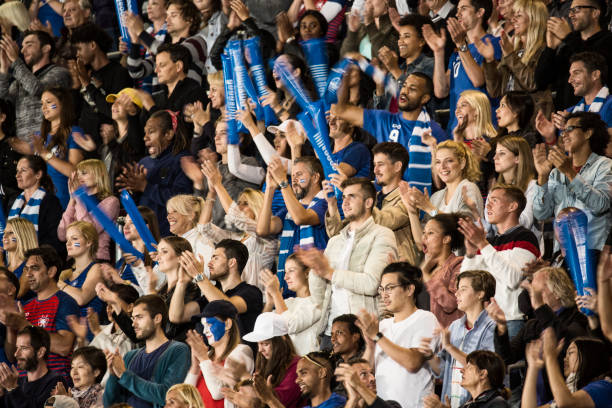 istock Group of spectators cheering in stadium 1127730066