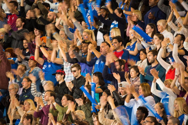 istock Group of spectators cheering in stadium 1127730070