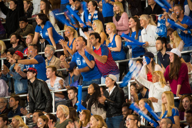 istock Group of spectators cheering in stadium 1127730077