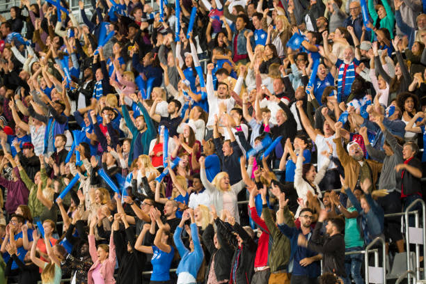 istock Group of spectators cheering in stadium 1127730080