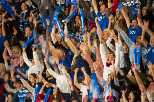 istock Group of spectators cheering in stadium 1127730093