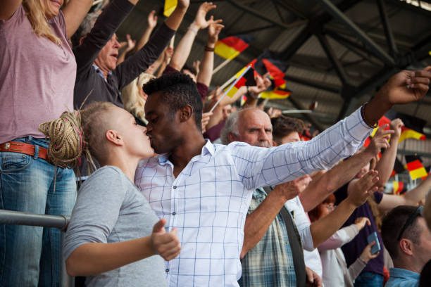 istock Couple kissing each other in stadium 1127730106