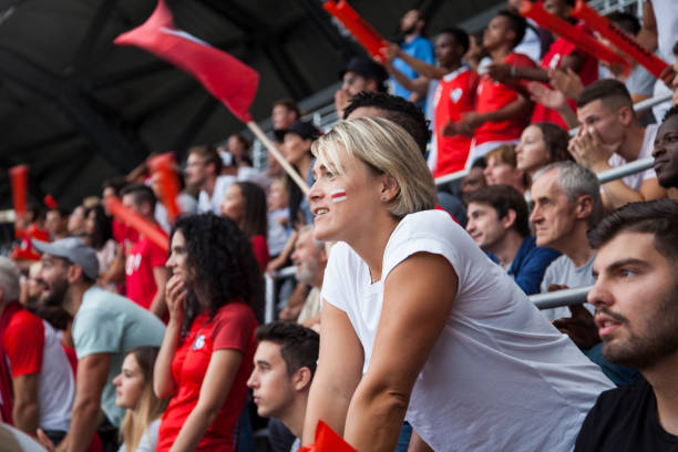 istock Spectators watching football match 1127730515