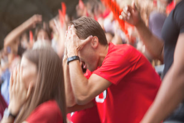 istock Spectators watching football match 1127730639