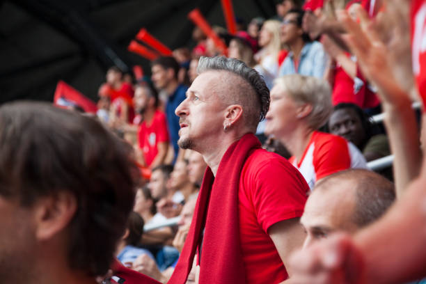 istock Spectators watching football match 1127730641
