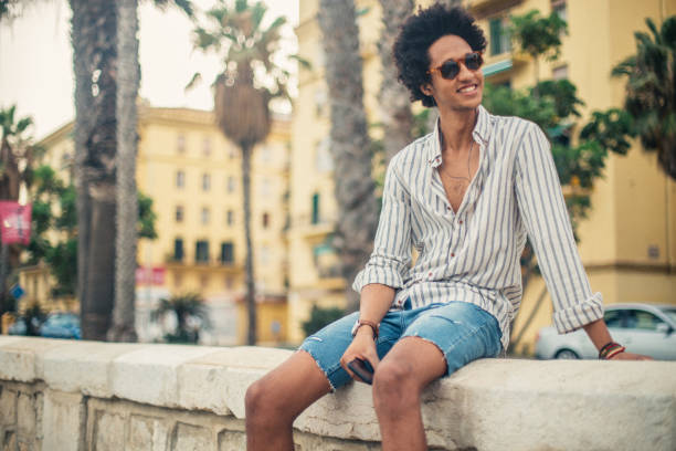 istock Young Man enjoying music outdoors 1127733579