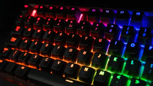 Photo of Backlit keyboard with rainbow colors - Orange, pink, blue, green