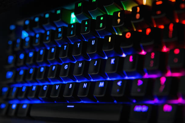 istock Backlit keyboard with rainbow colors - Blue, pink, orange, green 1127735300
