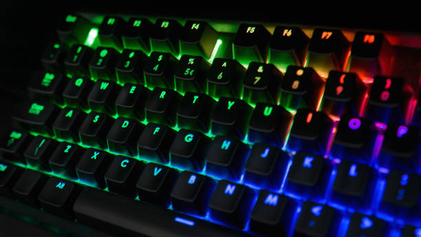 istock Backlit keyboard with rainbow colors - Green, blue, orange, pink 1127735317