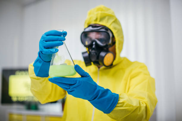 One man, scientist working in laboratory, holding test tube.
