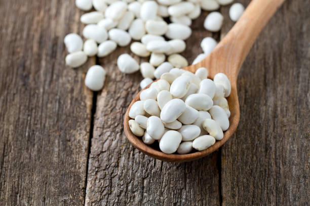 istock white butter beans on wooden surface 1127738658