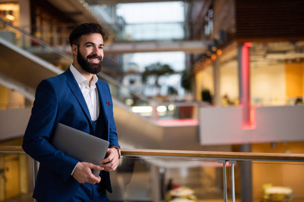 istock Business man holding laptop. 1127739807