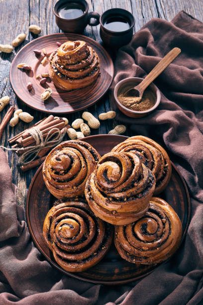 istock freshly baked Cinnamon rolls buns, top view 1127739874