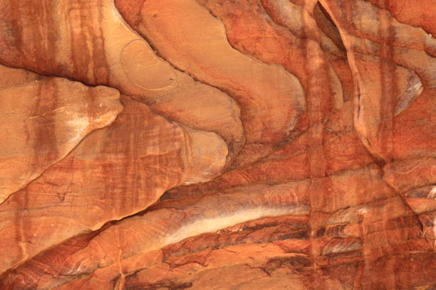 Colorful, red sandstone formation texture. Abstract geological pattern. Petra.