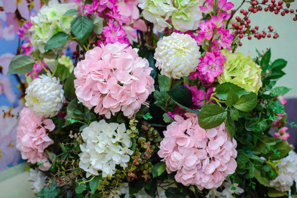 Background of a large beautiful bouquet of pink and white artificial flowers