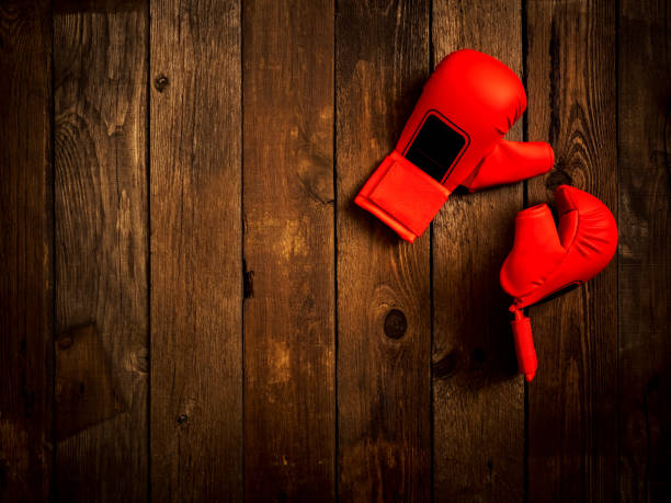 istock Leather karate gloves on the wooden background. Top view 1127748279