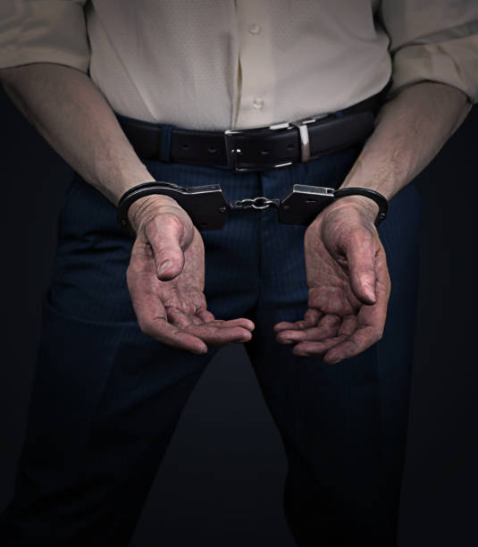 istock Businessman in handcuffs and with dirty hands 1127754948