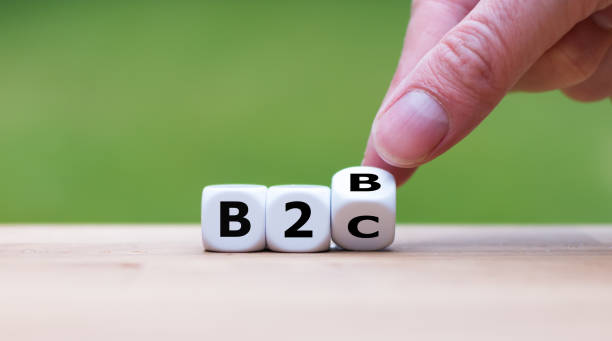 istock Business to Business or Busness to Consumer? Hand turns a dice and changes the expression 