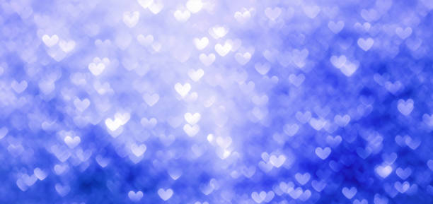 istock Heart shaped blue and white defocused lights background 1127756282