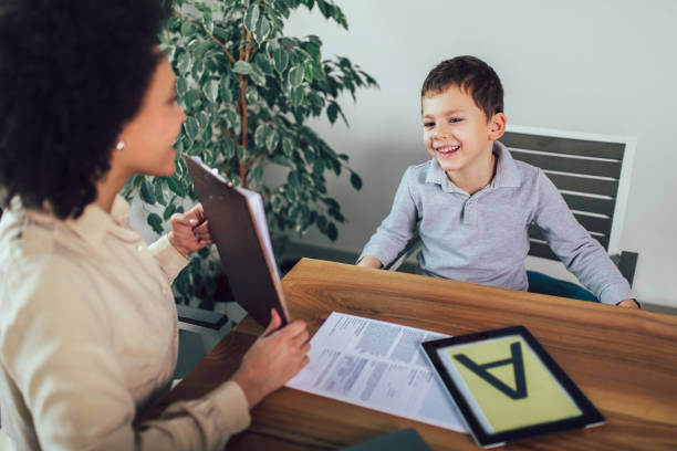 istock Shot of a speech therapist during a session with a little boy 1127757575