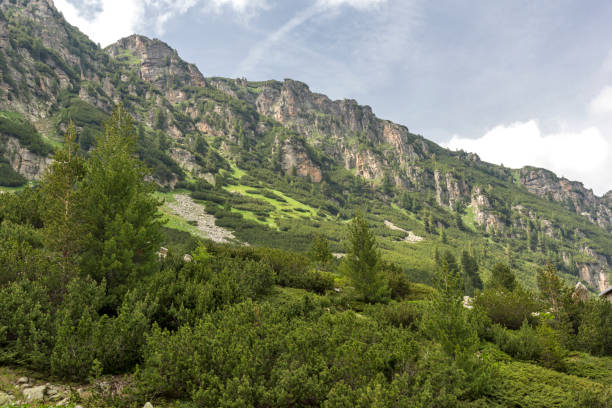 istock Dark clouds over Malyoviska river Valley, Rila Mountain, Bulgaria 1127759574