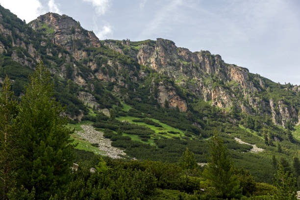 istock Dark clouds over Malyoviska river Valley, Rila Mountain, Bulgaria 1127759626