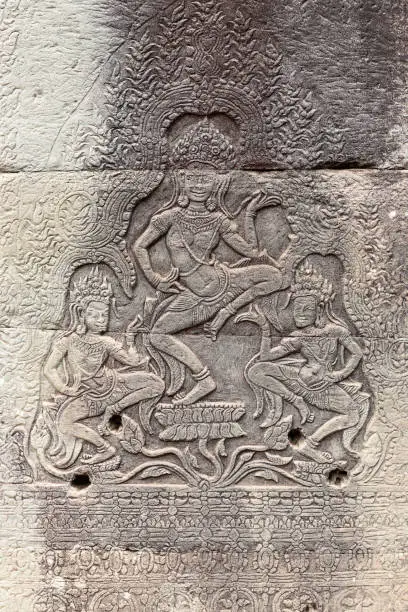 Photo of carvings on a wall in Angkor Thom temple showing Apsaras, Siem Reap, Cambodia, Asia