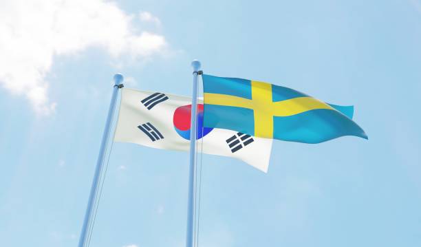 istock South Korea and Sweden, two flags waving against blue sky 1127761428