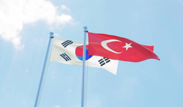 istock South Korea and Turkey, two flags waving against blue sky 1127761430