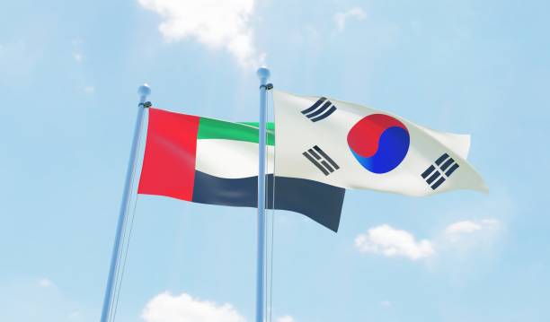 istock South Korea and UAE, two flags waving against blue sky 1127761524