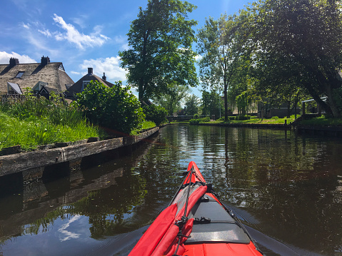 Kayaking in the Weerribben-Wieden nature reserve during a beautiful summer day