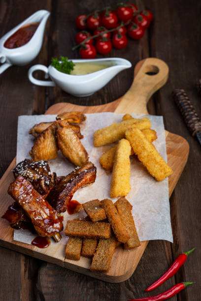 istock beer snacks: chicken wings, rye croutons, fried cheese 1127765549