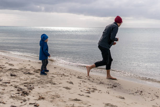 istock Throwing stones in the water 1127765640